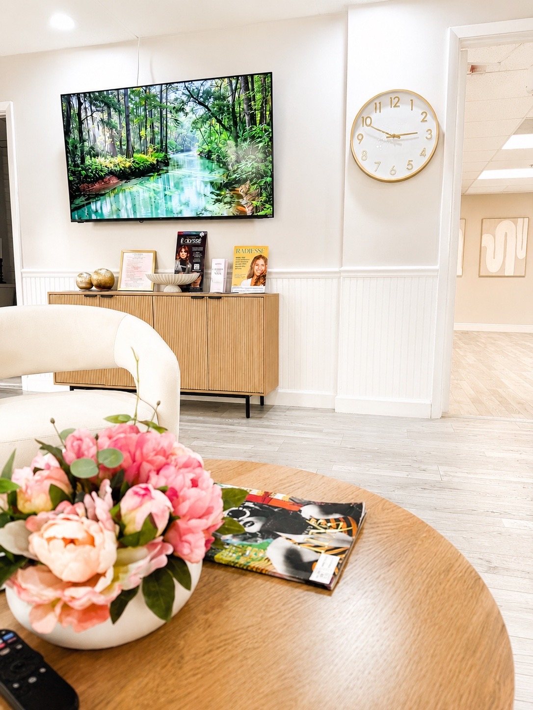 A quiet corner of the reception lounge with fresh peonies.